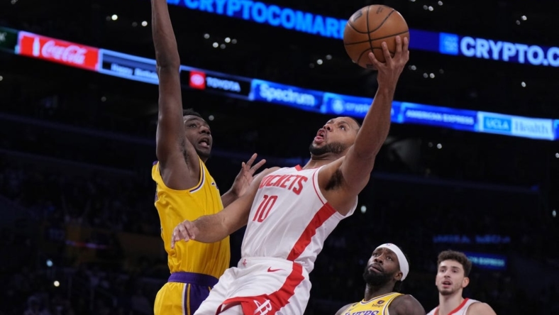 Jan 16, 2023; Los Angeles, California, USA; Houston Rockets guard Eric Gordon (10) shoots the ball against Los Angeles Lakers center Thomas Bryant (31) in the first half at Crypto.com Arena. Mandatory Credit: Kirby Lee-USA TODAY Sports