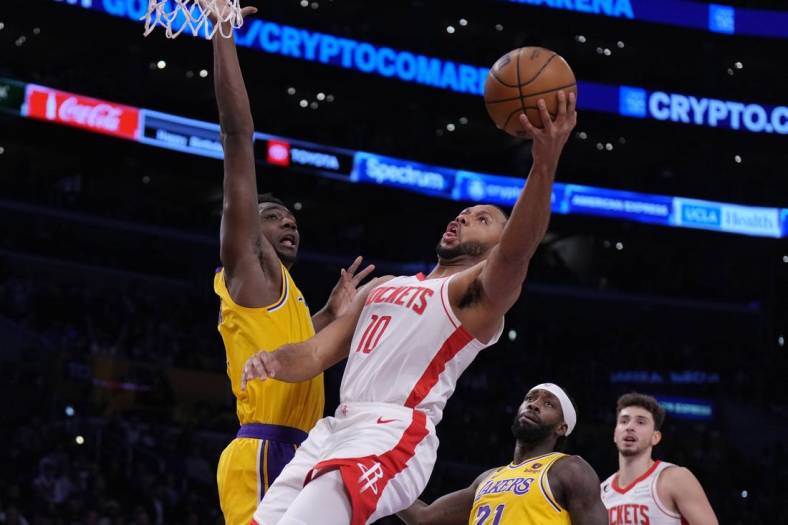 Jan 16, 2023; Los Angeles, California, USA; Houston Rockets guard Eric Gordon (10) shoots the ball against Los Angeles Lakers center Thomas Bryant (31) in the first half at Crypto.com Arena. Mandatory Credit: Kirby Lee-USA TODAY Sports