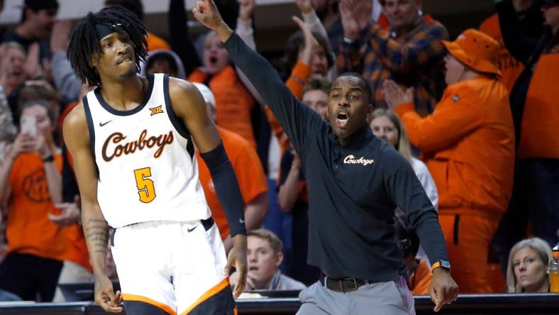 Oklahoma State head coach Mike Boynton and Caleb Asberry (5) react in the second half during the college basketball between the Oklahoma State Cowboys and the Texas Longhorns at Gallagher-Iba Arena in Stillwater, Okla., Saturday, Jan.7, 2023.

ss