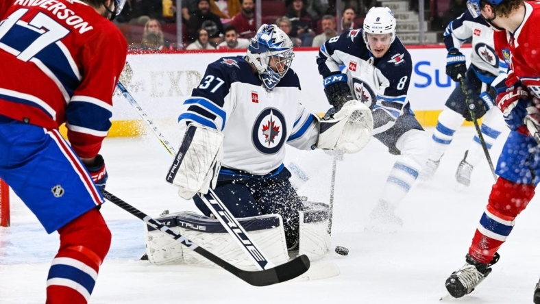 Jan 17, 2023; Montreal, Quebec, CAN; Winnipeg Jets goaltender Connor Hellebuyck (37) makes a save against the Montreal Canadiens during the second period at Bell Centre. Mandatory Credit: David Kirouac-USA TODAY Sports