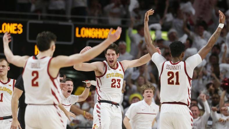 Iowa State University Cyclones forward Conrad Hawley (23)celebrates with guard Caleb Grill (2) and center Osun Osunniyi (21) during a time-out against Texas during the first half at Hilton Coliseum Tuesday, Jan. 17, 2022, in Ames, Iowa.  Photo by Nirmalendu Majumdar/Ames Tribune

Texas And Iowa State Men S Basketball