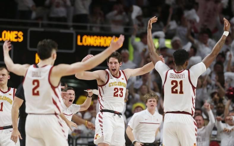 Iowa State University Cyclones forward Conrad Hawley (23)celebrates with guard Caleb Grill (2) and center Osun Osunniyi (21) during a time-out against Texas during the first half at Hilton Coliseum Tuesday, Jan. 17, 2022, in Ames, Iowa.  Photo by Nirmalendu Majumdar/Ames Tribune

Texas And Iowa State Men S Basketball