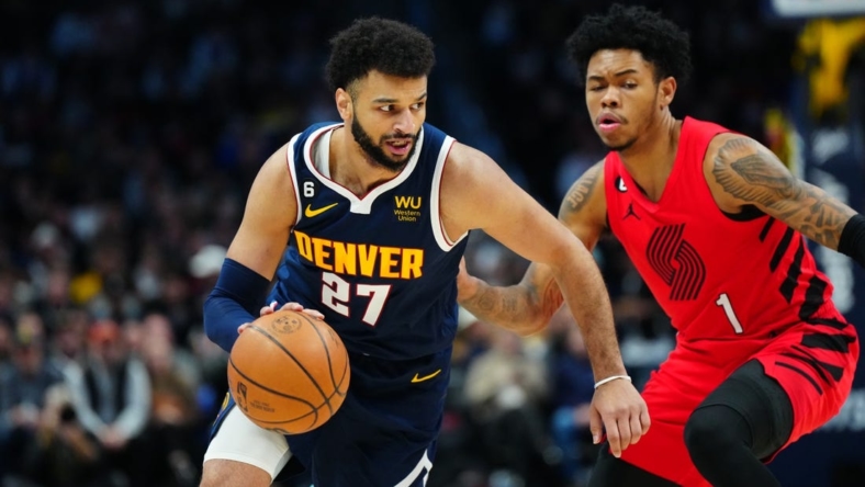 Jan 17, 2023; Denver, Colorado, USA; Denver Nuggets guard Jamal Murray (27) dribbles past Portland Trail Blazers guard Anfernee Simons (1) in the first quarter at Ball Arena. Mandatory Credit: Ron Chenoy-USA TODAY Sports