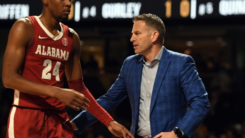 Jan 17, 2023; Nashville, Tennessee, USA; Alabama Crimson Tide head coach Nate Oats slaps hands with forward Brandon Miller (24) as he leaves the game during the first half against the Vanderbilt Commodores at Memorial Gymnasium. Mandatory Credit: Christopher Hanewinckel-USA TODAY Sports