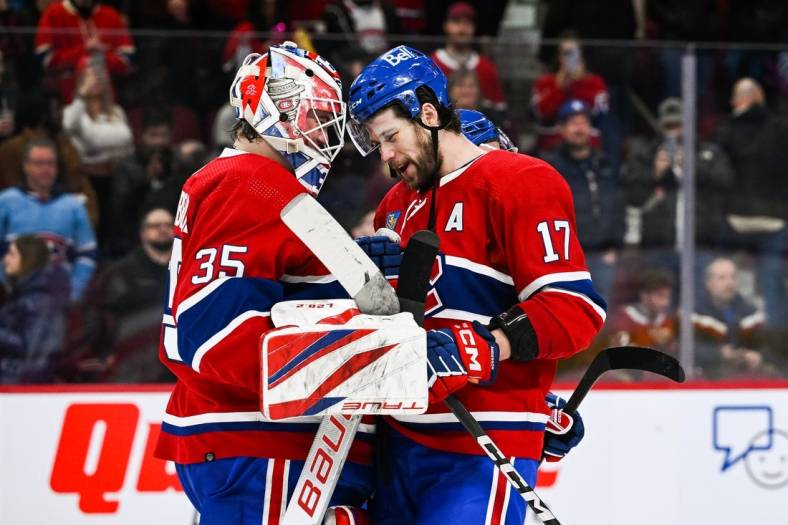 Jan 17, 2023; Montreal, Quebec, CAN; Montreal Canadiens right wing Josh Anderson (17) celebrates the win with goaltender Sam Montembeault (35) against the Winnipeg Jets after the third period at Bell Centre. Mandatory Credit: David Kirouac-USA TODAY Sports