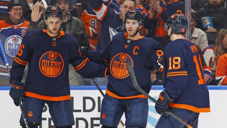 Jan 17, 2023; Edmonton, Alberta, CAN; The Edmonton Oilers celebrate a goal scored by forward Connor McDavid, center, during the first period against the Seattle Kraken at Rogers Place. Mandatory Credit: Perry Nelson-USA TODAY Sports