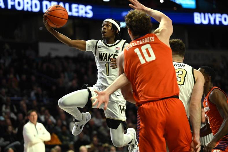 Jan 17, 2023; Winston-Salem, North Carolina, USA; Wake Forest Demon Deacons guard Tyree Appleby (1) goes to the basket past the Clemson Tigers defense during the first half at Lawrence Joel Veterans Memorial Coliseum. Mandatory Credit: William Howard-USA TODAY Sports
