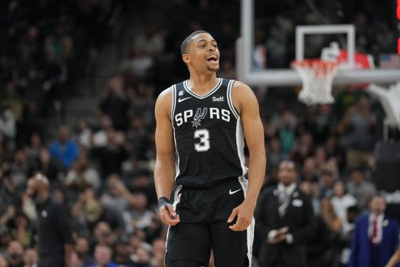 Jan 17, 2023; San Antonio, Texas, USA;  San Antonio Spurs forward Keldon Johnson (3) looks at the crowd after making a three point shot in the second half against the Brooklyn Nets at the AT&T Center. Mandatory Credit: Daniel Dunn-USA TODAY Sports