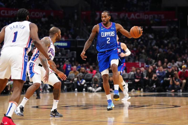 Jan 17, 2023; Los Angeles, California, USA; LA Clippers forward Kawhi Leonard (2) dribbles the ball against the Philadelphia 76ers in the second half at Crypto.com Arena. Mandatory Credit: Kirby Lee-USA TODAY Sports