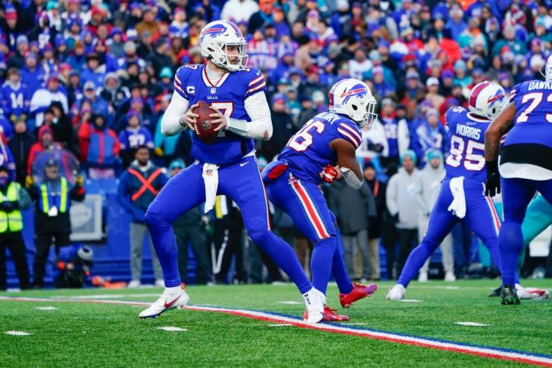 Jan 15, 2023; Orchard Park, New York, USA; Buffalo Bills quarterback Josh Allen (17) against the Miami Dolphins during a wild card game at Highmark Stadium. Mandatory Credit: Gregory Fisher-USA TODAY Sports
