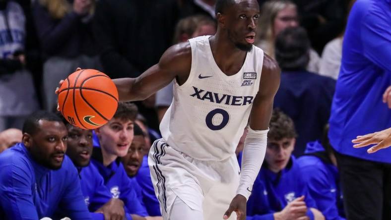 Jan 11, 2023; Cincinnati, Ohio, USA; Xavier Musketeers guard Souley Boum (0) dribbles against the Creighton Bluejays in the first half at Cintas Center. Mandatory Credit: Katie Stratman-USA TODAY Sports