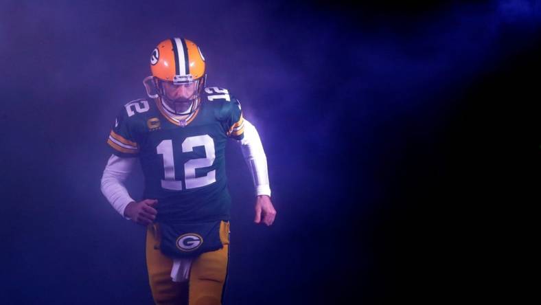 Green Bay Packers quarterback Aaron Rodgers (12) runs out on to the field as he is announced against the Detroit Lions during their football game Sunday, Jan. 8, 2023, at Lambeau Field in Green Bay, Wis.

Apc Packvsdetroit 0108230308djpa