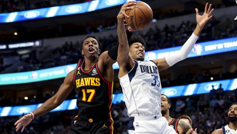 Jan 18, 2023; Dallas, Texas, USA;  Dallas Mavericks forward Christian Wood (35) and Atlanta Hawks forward Onyeka Okongwu (17) go for the loose ball during the first quarter at American Airlines Center. Mandatory Credit: Kevin Jairaj-USA TODAY Sports