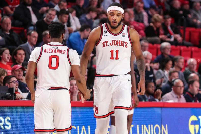 Jan 10, 2023; Queens, New York, USA;  St. John's Red Storm guard Posh Alexander (0) and center Joel Soriano (11) at Carnesecca Arena. Mandatory Credit: Wendell Cruz-USA TODAY Sports