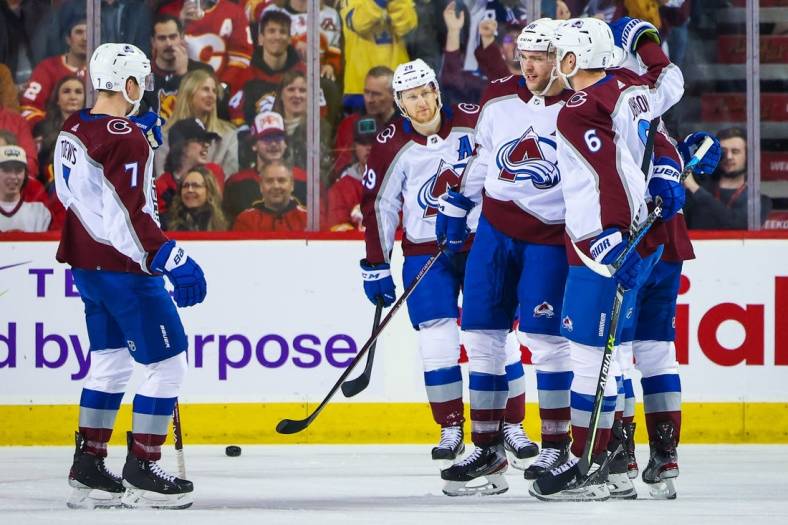 Jan 18, 2023; Calgary, Alberta, CAN; Colorado Avalanche right wing Mikko Rantanen (96) celebrates his goal with teammates against the Calgary Flames during the first period at Scotiabank Saddledome. Mandatory Credit: Sergei Belski-USA TODAY Sports