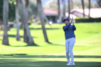 Jan 19, 2023; La Quinta, California, USA; Davis Thompson plays his second shot on the fourth hole during the first round of The American Express golf tournament at La Quinta Country Club. Mandatory Credit: Orlando Ramirez-USA TODAY Sports