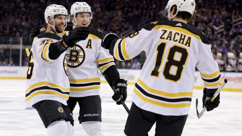 Jan 19, 2023; New York, New York, USA; Boston Bruins center Pavel Zacha (18) celebrates his goal against the New York Rangers with center David Krejci (46) and defenseman Charlie McAvoy (73) during the first period at Madison Square Garden. Mandatory Credit: Brad Penner-USA TODAY Sports