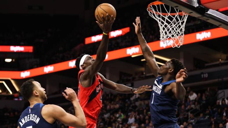 Jan 19, 2023; Minneapolis, Minnesota, USA; Toronto Raptors forward Pascal Siakam (43) shoots while Minnesota Timberwolves guard Anthony Edwards (1) defends during the first quarter at Target Center. Mandatory Credit: Matt Krohn-USA TODAY Sports