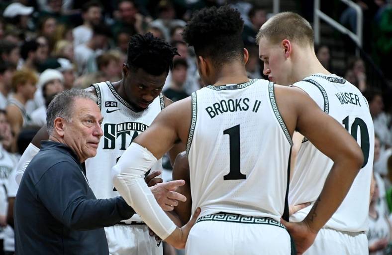 Jan 19, 2023; East Lansing, Michigan, USA; Michigan State Spartans head coach Tom Izzo huddles with his players in the first half against the Rutgers Scarlet Knights at Jack Breslin Student Events Center. Mandatory Credit: Dale Young-USA TODAY Sports