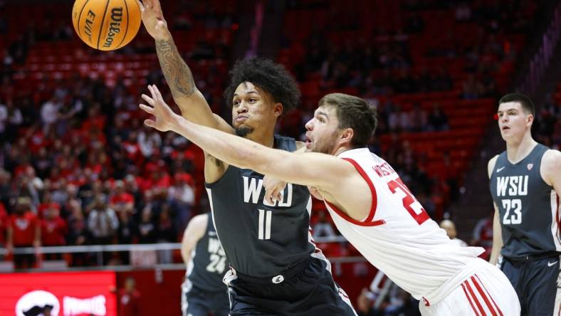 Jan 19, 2023; Salt Lake City, Utah, USA; Washington State Cougars forward DJ Rodman (11) and Utah Utes guard Rollie Worster (25) battle in the first half at Jon M. Huntsman Center. Mandatory Credit: Jeffrey Swinger-USA TODAY Sports