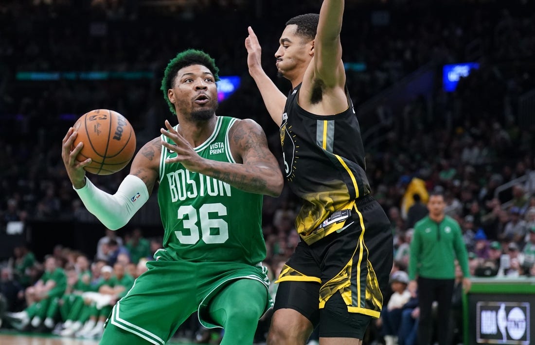 Jan 19, 2023; Boston, Massachusetts, USA; Boston Celtics guard Marcus Smart (36) drives the ball against Golden State Warriors guard Jordan Poole (3) in the second half at TD Garden. Mandatory Credit: David Butler II-USA TODAY Sports