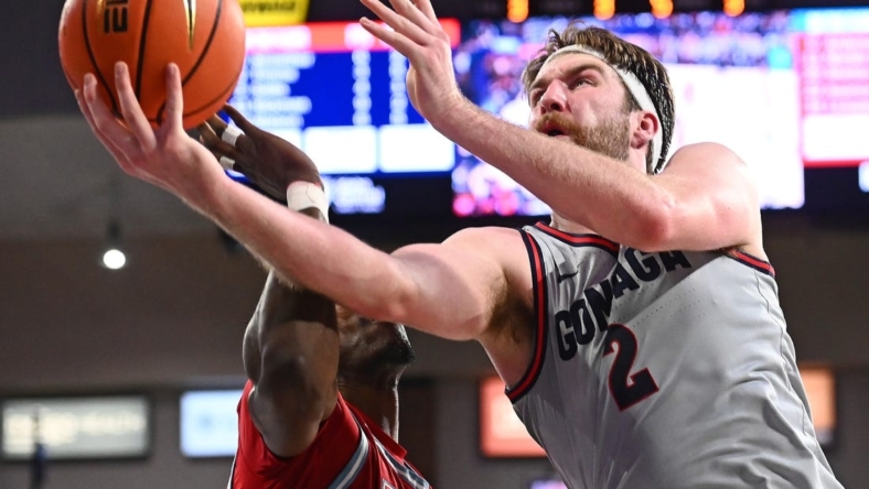 Jan 19, 2023; Spokane, Washington, USA; Gonzaga Bulldogs forward Drew Timme (2) shoots the ball against Loyola Marymount Lions center Rick Issanza (22) in the second half at McCarthey Athletic Center. Lions won 68-67. Mandatory Credit: James Snook-USA TODAY Sports