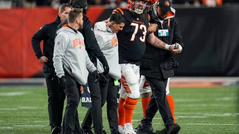 Cincinnati Bengals offensive tackle Jonah Williams (73) is assisted off the field after being injured on a play in the second quarter during an NFL wild-card playoff football game between the Baltimore Ravens and the Cincinnati Bengals, Sunday, Jan. 15, 2023, at Paycor Stadium in Cincinnati.The Ravens led 10-9 at halftime.

Baltimore Ravens At Cincinnati Bengals Afc Wild Card Jan 15 217

Syndication The Enquirer