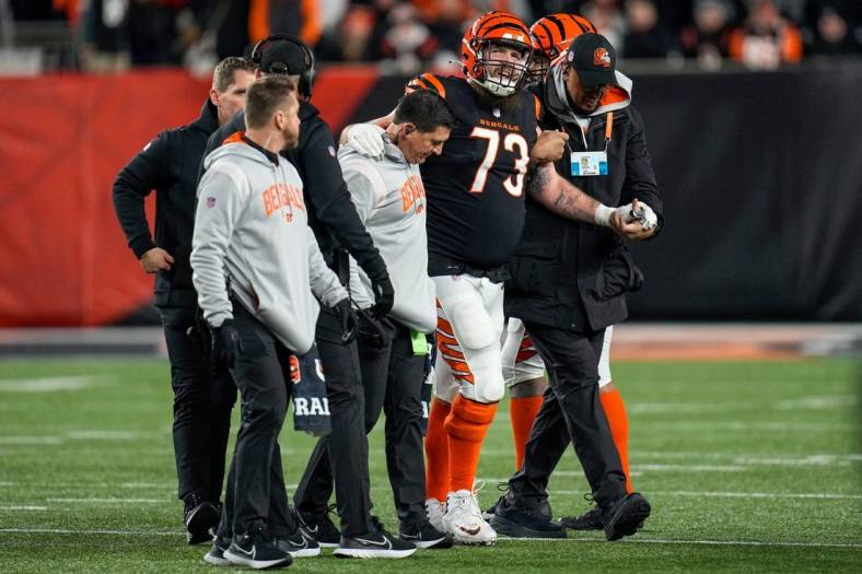 Cincinnati Bengals offensive tackle Jonah Williams (73) is assisted off the field after being injured on a play in the second quarter during an NFL wild-card playoff football game between the Baltimore Ravens and the Cincinnati Bengals, Sunday, Jan. 15, 2023, at Paycor Stadium in Cincinnati.The Ravens led 10-9 at halftime.

Baltimore Ravens At Cincinnati Bengals Afc Wild Card Jan 15 217

Syndication The Enquirer