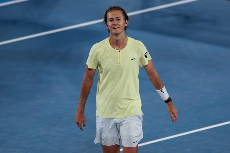 Jan 20, 2023; Melbourne, Victoria, Australia; Sebastian Korda of the United States celebrates his victory over Daniil Medvedev of Russia on day five of the 2023 Australian Open tennis tournament at Melbourne Park. Mandatory Credit: Mike Frey-USA TODAY Sports