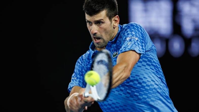 Jan 21, 2023; Melbourne, Victoria, Australia; Novak Djokovic of Serbia celebrates his victory over Grigor Dimitrov of Bulgaria on day six of the 2023 Australian Open tennis tournament at Melbourne Park. Mandatory Credit: Mike Frey-USA TODAY Sports