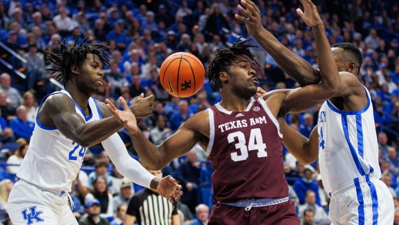 Jan 21, 2023; Lexington, Kentucky, USA; Texas A&M Aggies forward Julius Marble (34) goes after a loose ball during the first half against the Kentucky Wildcats at Rupp Arena at Central Bank Center. Mandatory Credit: Jordan Prather-USA TODAY Sports