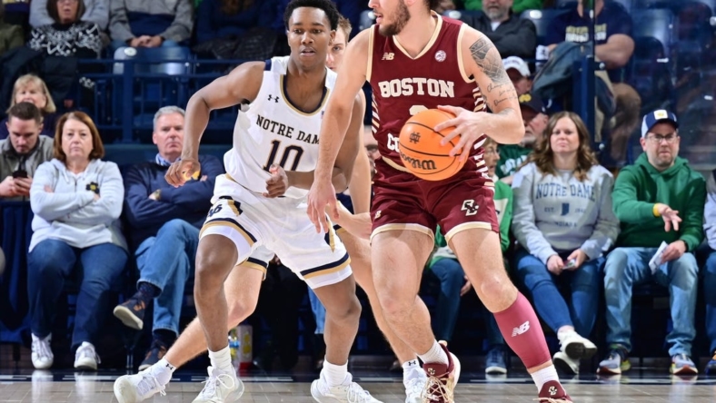 Jan 21, 2023; South Bend, Indiana, USA; Boston College Eagles guard Jaeden Zackery (3) dribbles the ball against Notre Dame Fighting Irish guard Marcus Hammond (10) in the first half at the Purcell Pavilion. Mandatory Credit: Matt Cashore-USA TODAY Sports