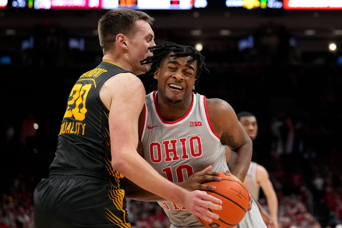 Jan 21, 2023; Columbus, OH, USA;  Ohio State Buckeyes forward Brice Sensabaugh (10) collides with Iowa Hawkeyes forward Payton Sandfort (20) during the first half of the NCAA division I men   s basketball game between the Ohio State Buckeyes and the Iowa Hawkeyes at Value City Arena. Mandatory Credit: Joseph Scheller-The Columbus Dispatch

Basketball Ceb Mbk Iowa Iowa At Ohio State