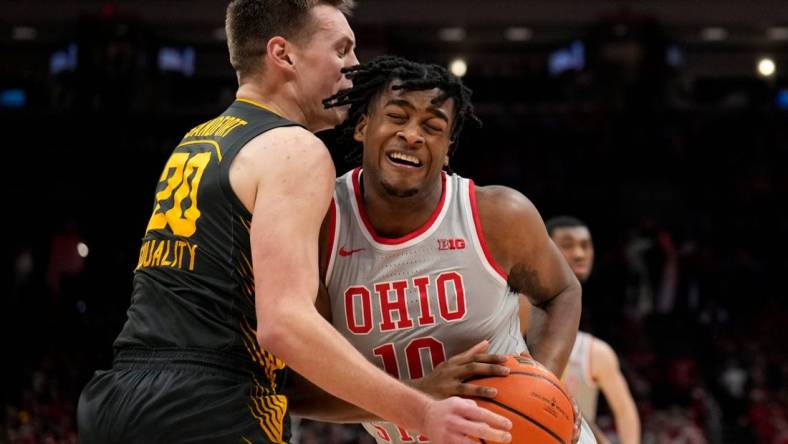 Jan 21, 2023; Columbus, OH, USA;  Ohio State Buckeyes forward Brice Sensabaugh (10) collides with Iowa Hawkeyes forward Payton Sandfort (20) during the first half of the NCAA division I men   s basketball game between the Ohio State Buckeyes and the Iowa Hawkeyes at Value City Arena. Mandatory Credit: Joseph Scheller-The Columbus Dispatch

Basketball Ceb Mbk Iowa Iowa At Ohio State