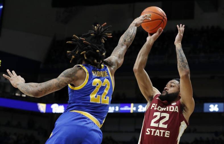 Jan 21, 2023; Pittsburgh, Pennsylvania, USA;  Florida State Seminoles guard Darin Green Jr. (22) shoots a three point basket against Pittsburgh Panthers guard Nike Sibande (22) during the first half at the Petersen Events Center. Mandatory Credit: Charles LeClaire-USA TODAY Sports