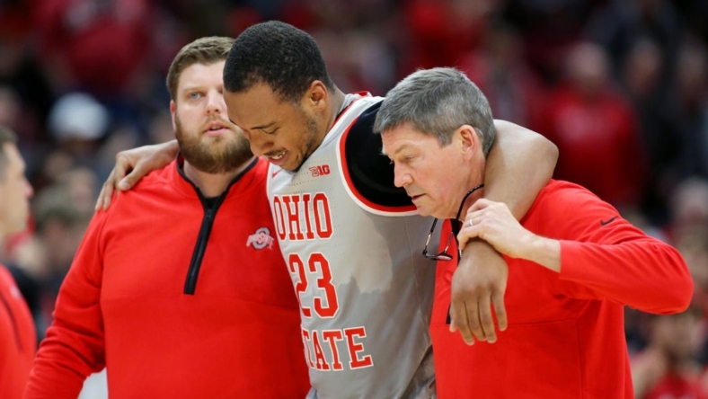 Jan 21, 2023; Columbus, Ohio, USA;  Ohio State Buckeyes forward Zed Key (23) leaves the court with a knee injury during the second half against the Iowa Hawkeyes at Value City Arena. Mandatory Credit: Joseph Maiorana-USA TODAY Sports