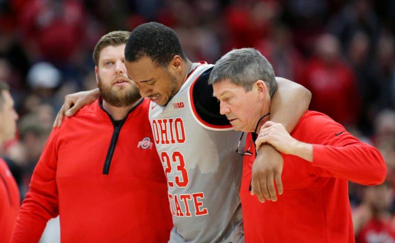 Jan 21, 2023; Columbus, Ohio, USA;  Ohio State Buckeyes forward Zed Key (23) leaves the court with a knee injury during the second half against the Iowa Hawkeyes at Value City Arena. Mandatory Credit: Joseph Maiorana-USA TODAY Sports