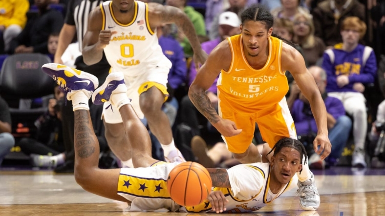 Jan 21, 2023; Baton Rouge, Louisiana, USA;  LSU Tigers forward Derek Fountain (20) knocks the ball away from Tennessee Volunteers guard Zakai Zeigler (5) during the first half at Pete Maravich Assembly Center. Mandatory Credit: Stephen Lew-USA TODAY Sports