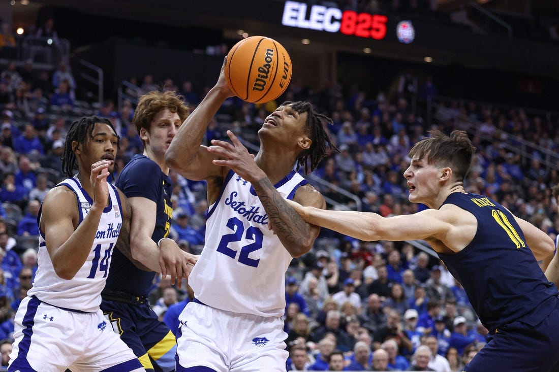 Jan 21, 2023; Newark, New Jersey, USA; Seton Hall Pirates forward Tae Davis (22) is fouled by Marquette Golden Eagles guard Tyler Kolek (11) in front of forward Ben Gold (21) and guard Dre Davis (14) during the second half at Prudential Center. Mandatory Credit: Vincent Carchietta-USA TODAY Sports