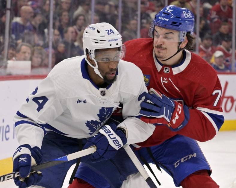 Jan 21, 2023; Montreal, Quebec, CAN; Toronto Maple Leafs forward Wayne Simmonds (24) and Montreal Canadiens defenseman Arber Xhekaj (72) battle for the puck during the first period at the Bell Centre. Mandatory Credit: Eric Bolte-USA TODAY Sports