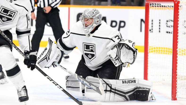 Jan 21, 2023; Nashville, Tennessee, USA; Los Angeles Kings goaltender Jonathan Quick (32) watches the puck after a save during the first period against the Nashville Predators at Bridgestone Arena. Mandatory Credit: Christopher Hanewinckel-USA TODAY Sports