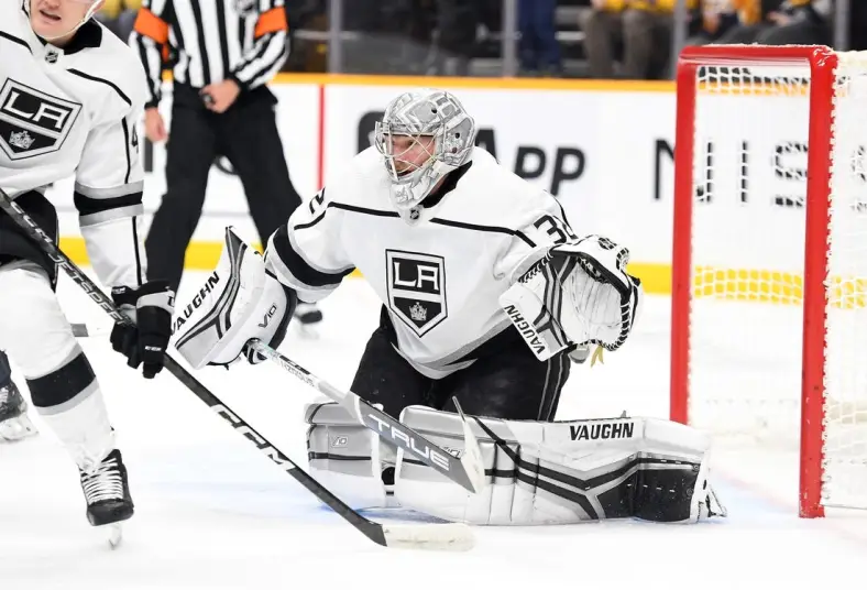 Jan 21, 2023; Nashville, Tennessee, USA; Los Angeles Kings goaltender Jonathan Quick (32) watches the puck after a save during the first period against the Nashville Predators at Bridgestone Arena. Mandatory Credit: Christopher Hanewinckel-USA TODAY Sports