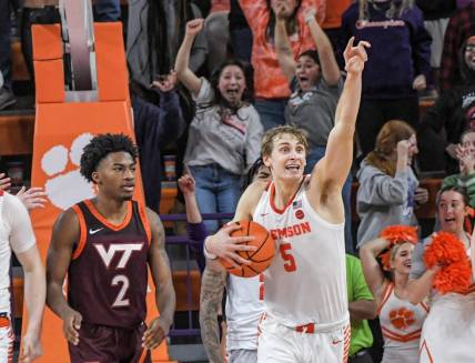 January 21, 2023; Clemson, SC; Clemson forward Hunter Tyson (5) holds on to a rebound near Virginia Tech guard Michael Collins Jr (2) as time expired  at Littlejohn Coliseum in Clemson, S.C. Saturday, January 21, 2023. Hunter made the go-ahead three-point shot and rebound in the end helping the Tigers win 51-50.  Mandatory Credit: Ken Ruinard-USA TODAY NETWORK