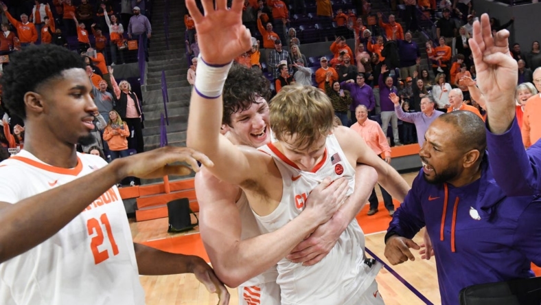 January 21, 2023; Clemson, SC; Clemson sophomore forward PJ Hall (24) hugs forward Hunter Tyson (5) near freshman forward Chauncey Wiggins (21) after the Tigers beat Virginia Tech at Littlejohn Coliseum in Clemson, S.C. Saturday, January 21, 2023. Hunter made the go-ahead three-point shot and rebound in the end helping the Tigers win 51-50. Hall led the Tigers with 20 points.  Mandatory Credit: Ken Ruinard-USA TODAY NETWORK