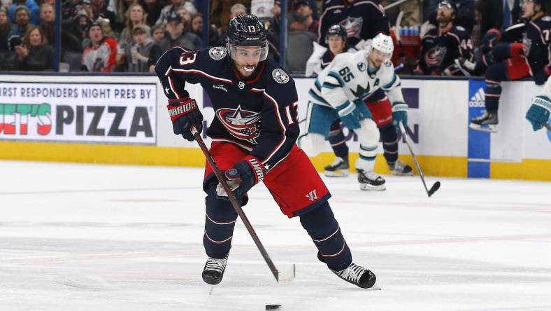 Jan 21, 2023; Columbus, Ohio, USA; Columbus Blue Jackets left wing Johnny Gaudreau (13) controls the puck against the San Jose Sharks during the third period at Nationwide Arena. Mandatory Credit: Russell LaBounty-USA TODAY Sports