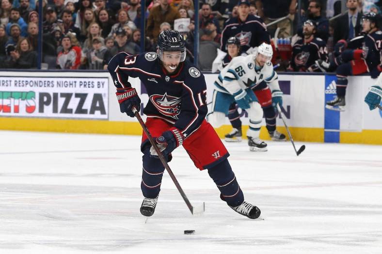 Jan 21, 2023; Columbus, Ohio, USA; Columbus Blue Jackets left wing Johnny Gaudreau (13) controls the puck against the San Jose Sharks during the third period at Nationwide Arena. Mandatory Credit: Russell LaBounty-USA TODAY Sports