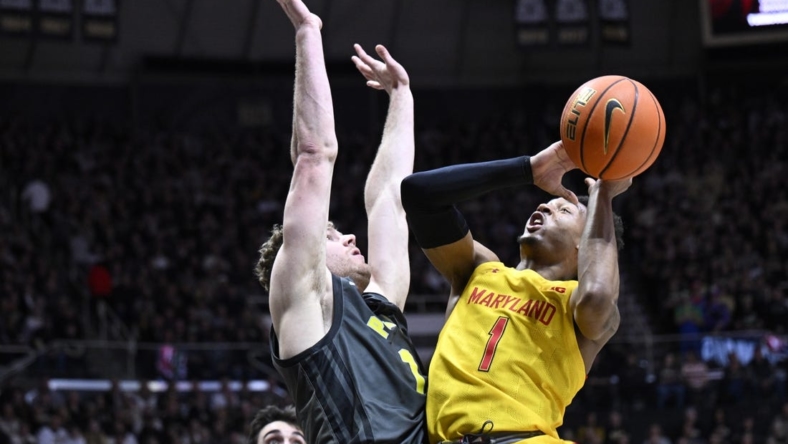 Jan 22, 2023; West Lafayette, Indiana, USA; Maryland Terrapins guard Jahmir Young (1) shoots the ball against Purdue Boilermakers forward Caleb Furst (1) during the first half at Mackey Arena. Mandatory Credit: Marc Lebryk-USA TODAY Sports