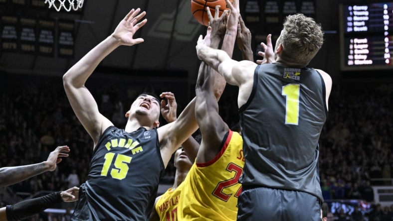 9Jan 22, 2023; West Lafayette, Indiana, USA;  Purdue Boilermakers center Zach Edey (15) and forward Caleb Furst (1) fights for a rebound against Maryland Terrapins forward Donta Scott (24) during the second half at Mackey Arena. Mandatory Credit: Marc Lebryk-USA TODAY Sports