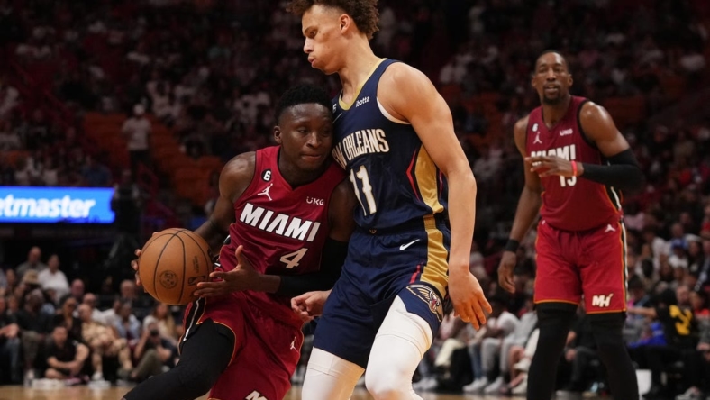 Jan 22, 2023; Miami, Florida, USA; Miami Heat guard Victor Oladipo (4) drives the ball against New Orleans Pelicans guard Dyson Daniels (11) during the first half at Miami-Dade Arena. Mandatory Credit: Jasen Vinlove-USA TODAY Sports