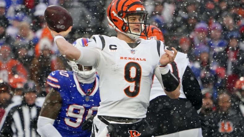 Jan 22, 2023; Orchard Park, New York, USA; Cincinnati Bengals quarterback Joe Burrow (9) passes the ball against the Buffalo Bills during the second quarter of an AFC divisional round game at Highmark Stadium. Mandatory Credit: Gregory Fisher-USA TODAY Sports